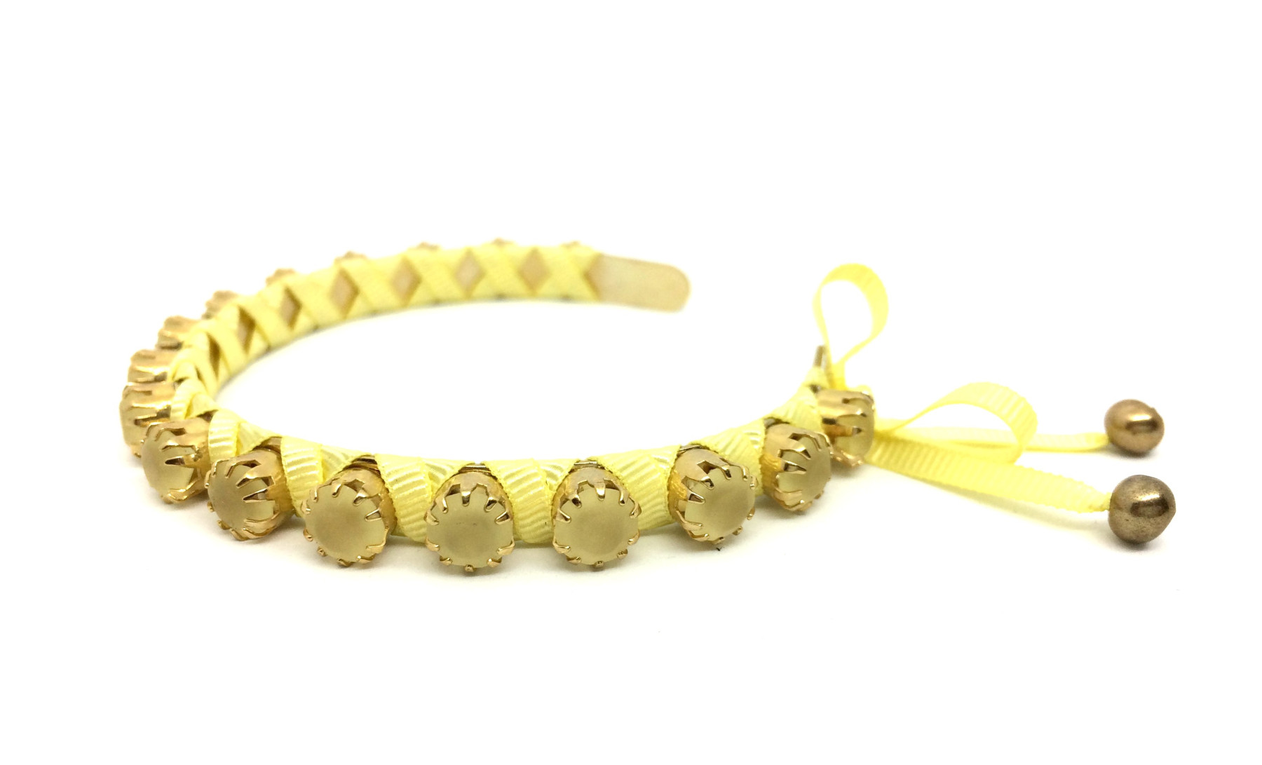 bracciale rigido regolabile con cristalli opachi e nastro gialli art. B000081