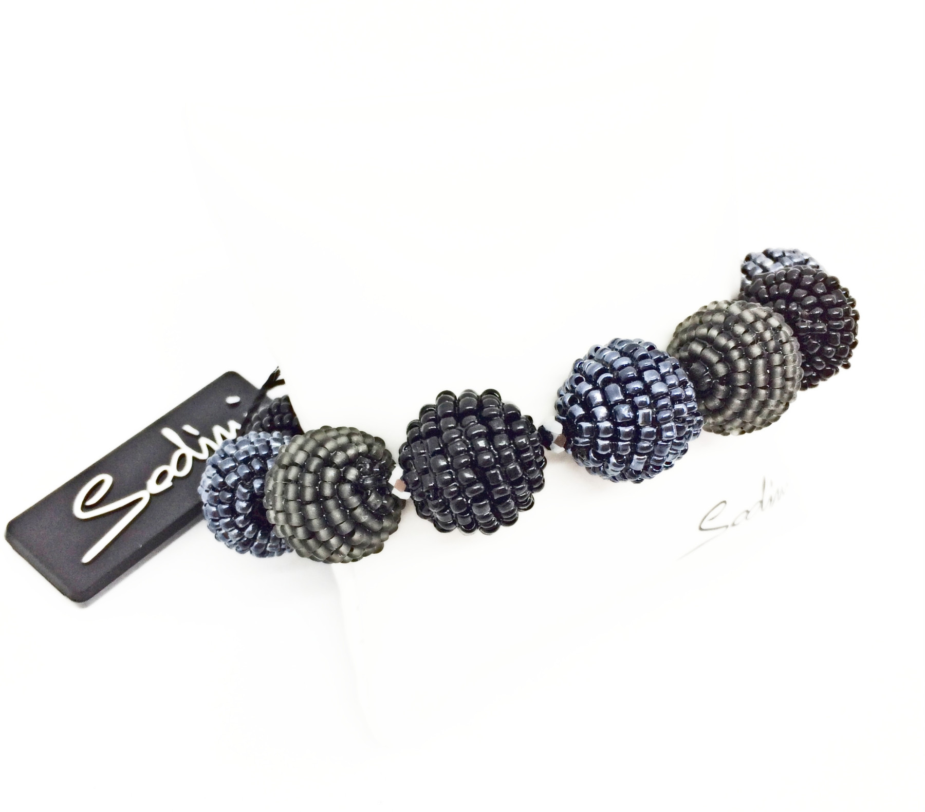 Bracciale elastico di sfere con perle nere e grigie art. 861253P