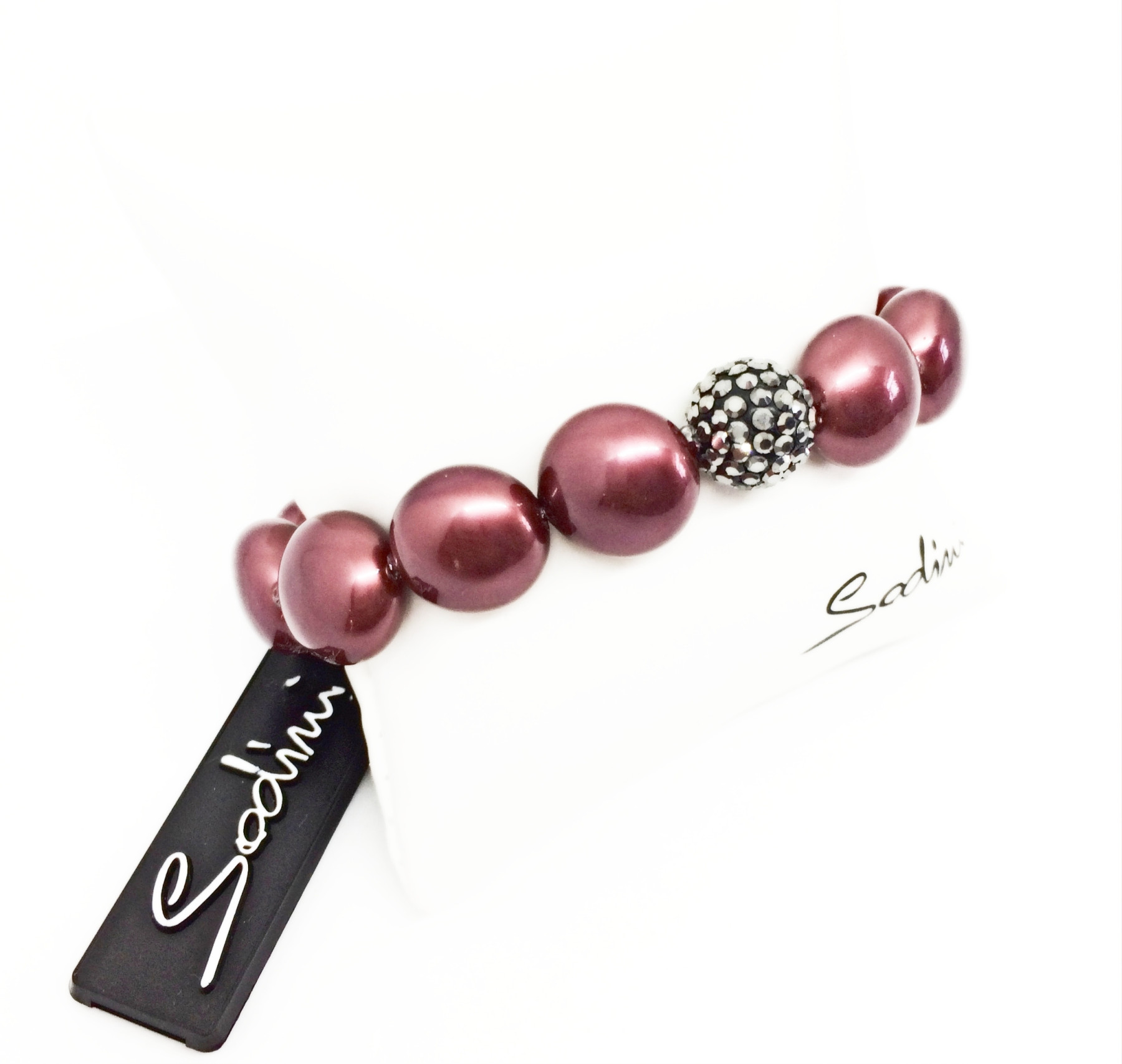 bracciale elastico di perle rosse schiacciate e strass grigi art. 930161XS